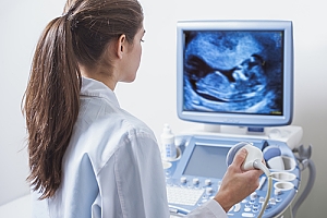 Doctor performing ultrasound