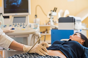 Woman laying on back during ultrasound