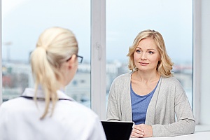 a doctor discussing menopause with a patient