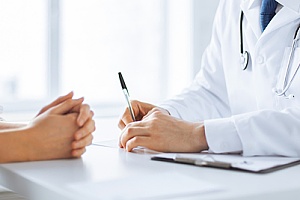 a doctor performing STD testing with a patient