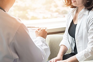 a GYN performing a breast examination