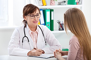 a nurse practitioner discussing HPV with a patient