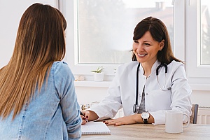 a woman receiving being checked for sexually transmitted diseases