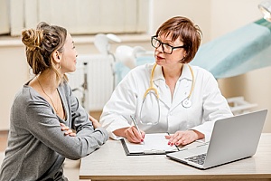 woman receiving GYN wellness screening