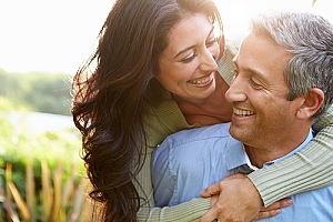 Happy and healthy couple smiling together