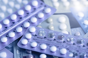 Pile of small pills in plastic packaging