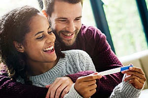 couple looking at pregnancy test