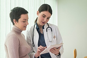 doctor educating woman on contraceptive care