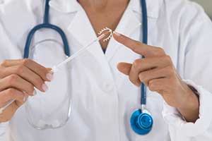 Raleigh gynecologist getting ready to insert IUDs