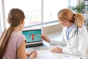 Young woman and a gynecologist at a clinic. Endometriosis is a common condition in many women.
