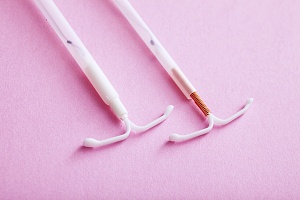 two IUD against pink background to break IUD myths 
