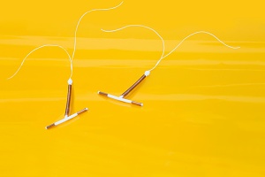 two IUD on yellow background with how effective is an IUD