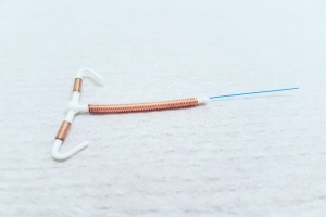 copper IUD on the counter being removed