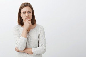 A female standing thoughtful. Nexplanon implant may be one of the effective option for you