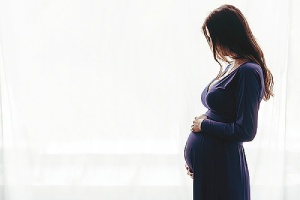 Silhouette of a pregnant female. Nexplanon implant include both immediate and long-term effectiveness