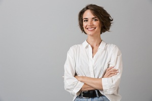 woman posing over grey wall background. Nexplanon is ideal for many women