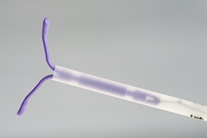 close up of a IUD with the insertion tube