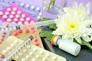 a bunch of Hormonal Contraception laying on table