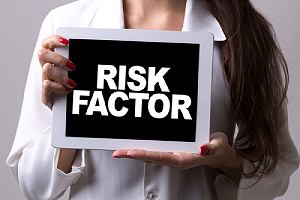 A woman holding a tablet with the text Risk Factor. Not all of the side effects are negative