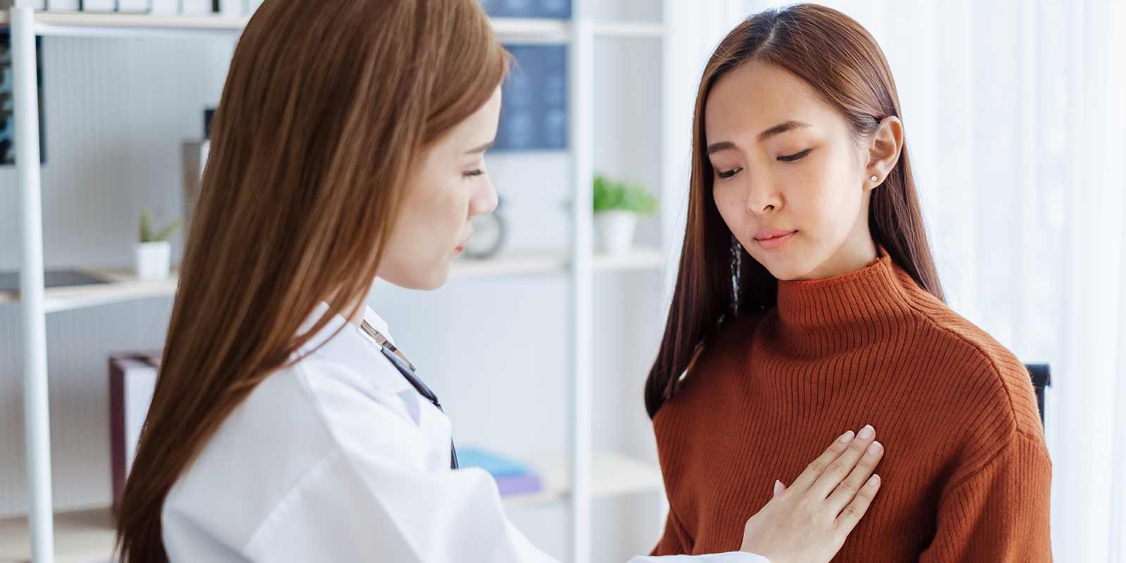 Doctor examining Breast health a woman