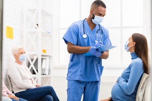 male nurse practitioner fixing patient appointment with doctor