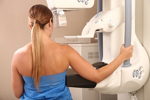 woman in 40s about to undergoing a test knowing What To Expect From A Mammogram