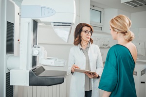 oncologist talking with her patient on mammography examination for her Breast Care