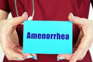 nurse holding amenorrhea card in hand for Menstrual Disorders