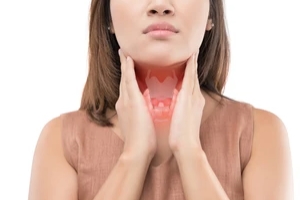 women hands on neck and thyroid glands because of a Menstrual Disorders