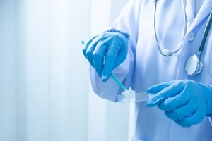 doctor taking Pap Smear sample