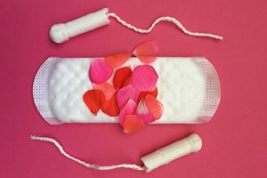 womans period showing flower petals on sanitary protection for Menstrual Disorders