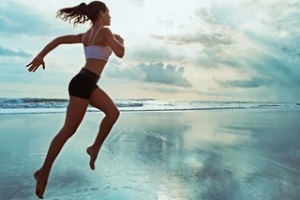 women workout on the beach