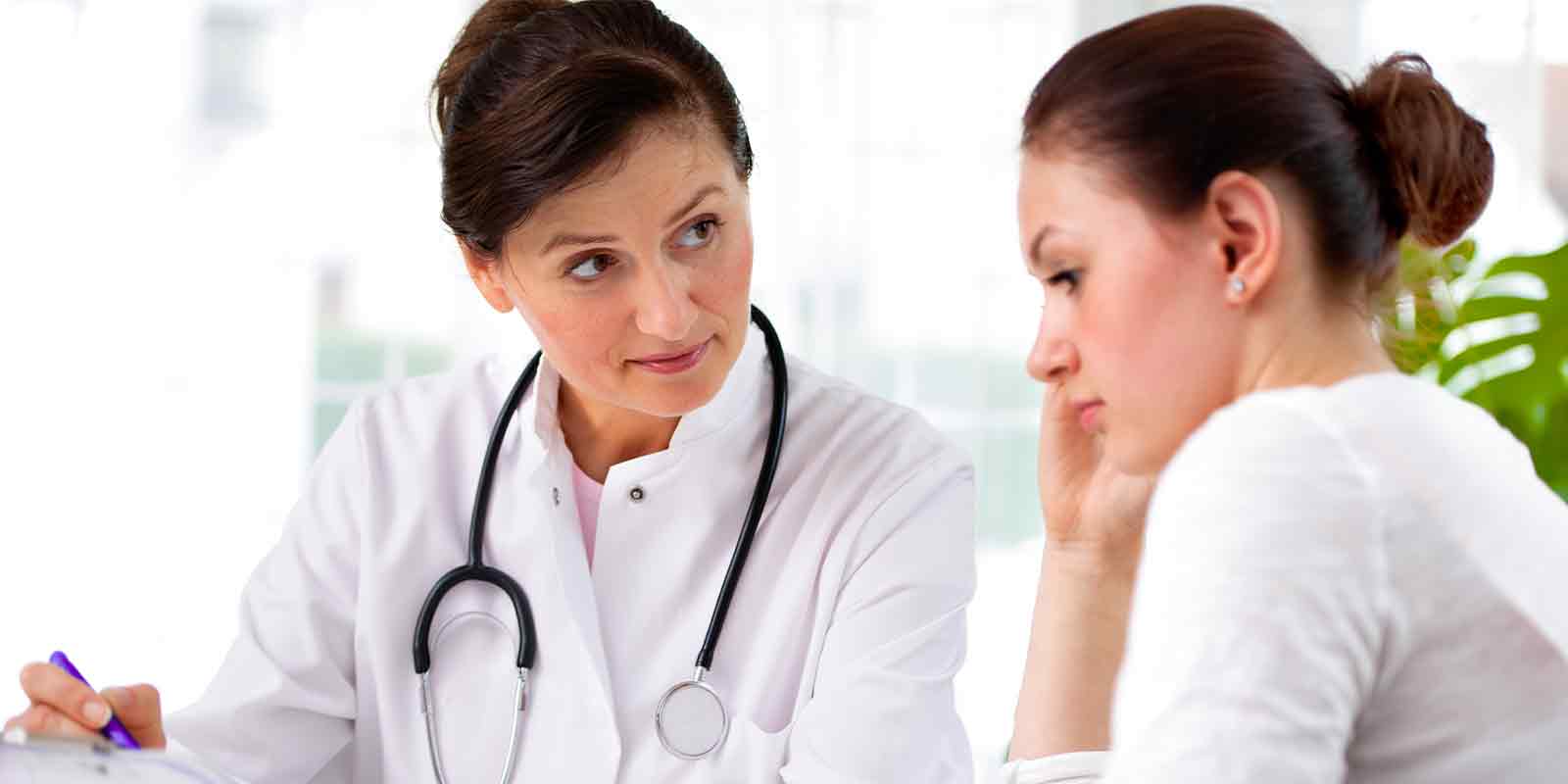 women talking to doctor about What Is Dysmenorrhea