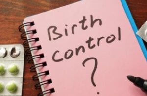 birth control written in notebook needing IUD Insertion Process