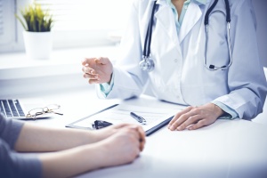 doctor meeting with client about Endometrial Biopsy