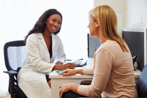 women talking to doctor about Endometrial Biopsy