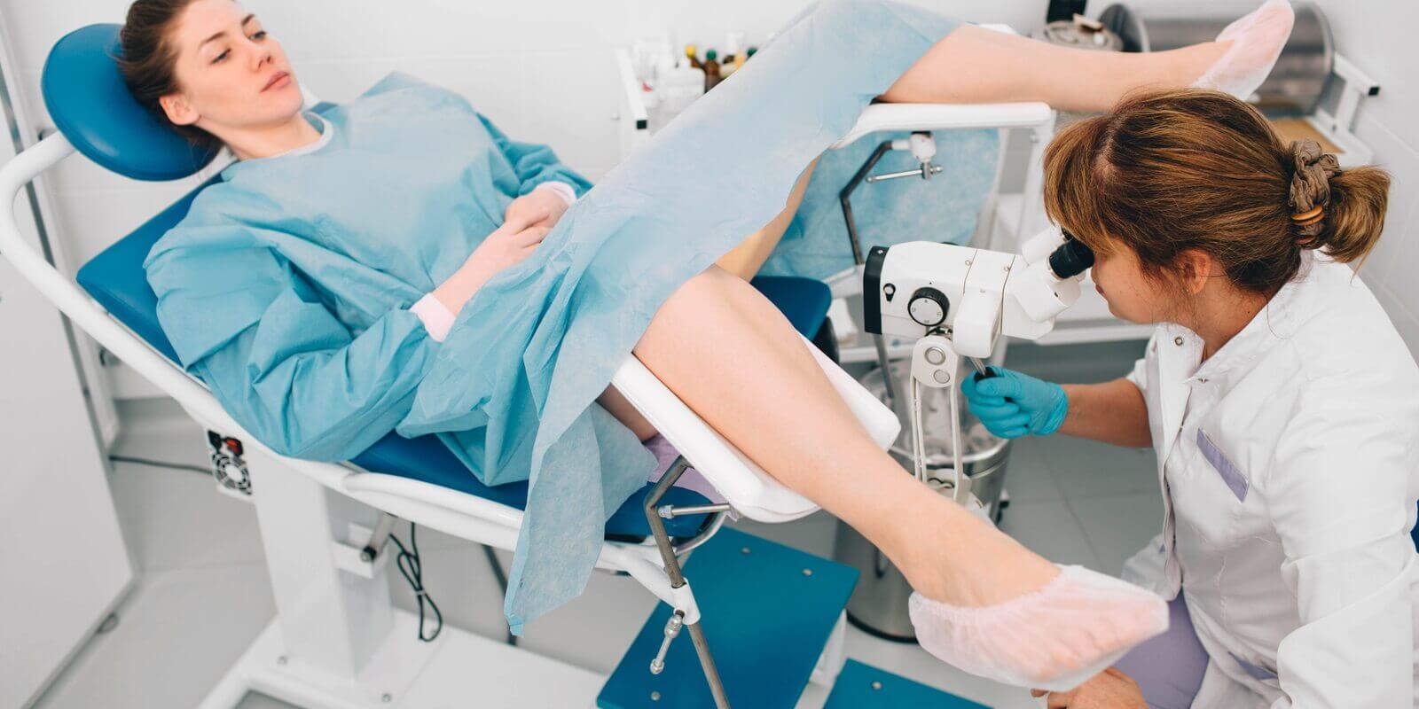 woman during examination by a gynecologist