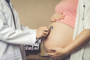 pregnant woman visit gynecologist doctor at hospital or medical clinic