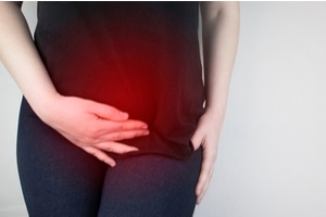 woman suffers from pain in the pelvic organs