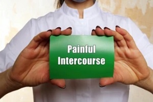 doctor holding painful intercourse paper in hand