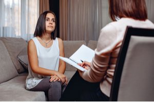 A woman and a female pelvic floor therapist during a session