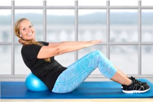 A woman exercising on a yoga mat