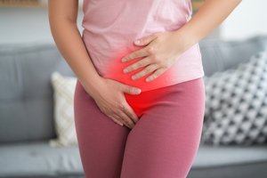 A woman experiencing pelvic floor muscles pain
