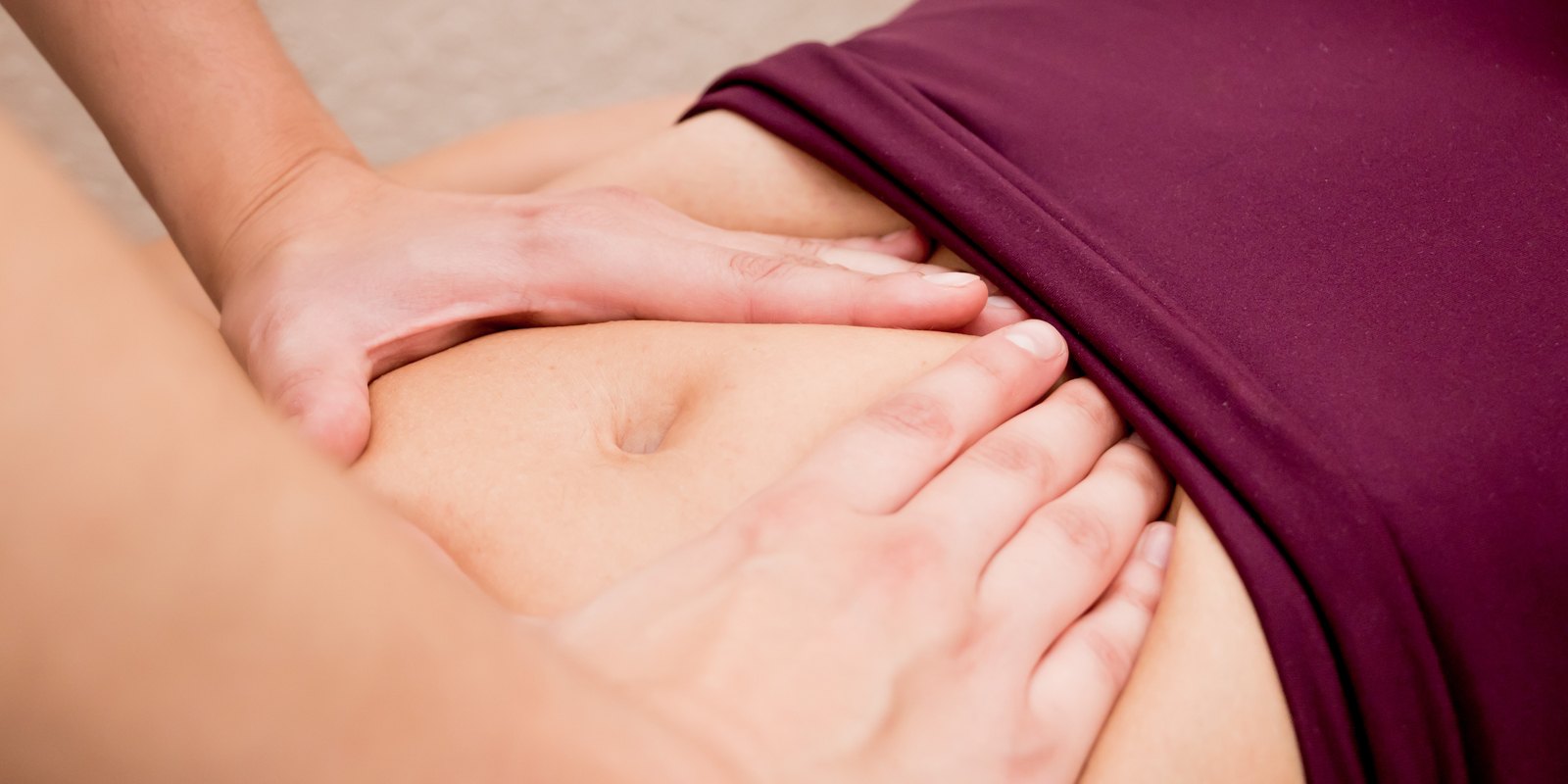 Pelvic floor therapist examining pelvic floor muscles of a woman