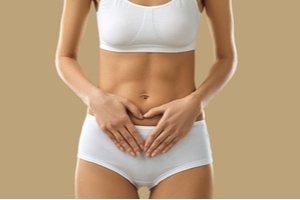 Woman showing pelvic floor area of her body