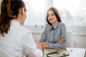 A pelvic floor therapist with her patient in her office