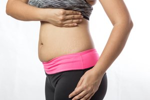 A woman is experiencing post-pregnancy pain