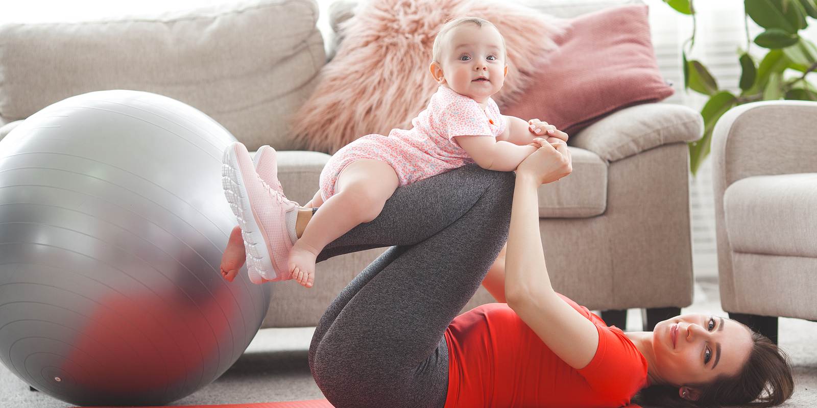 A woman with her baby doing pelvic exercise