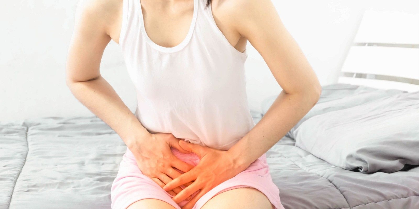 a woman is experiencing pain during ovulation
