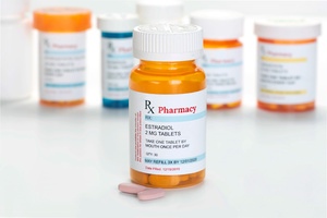 Estradiol estrogen pills with other prescription medication bottles